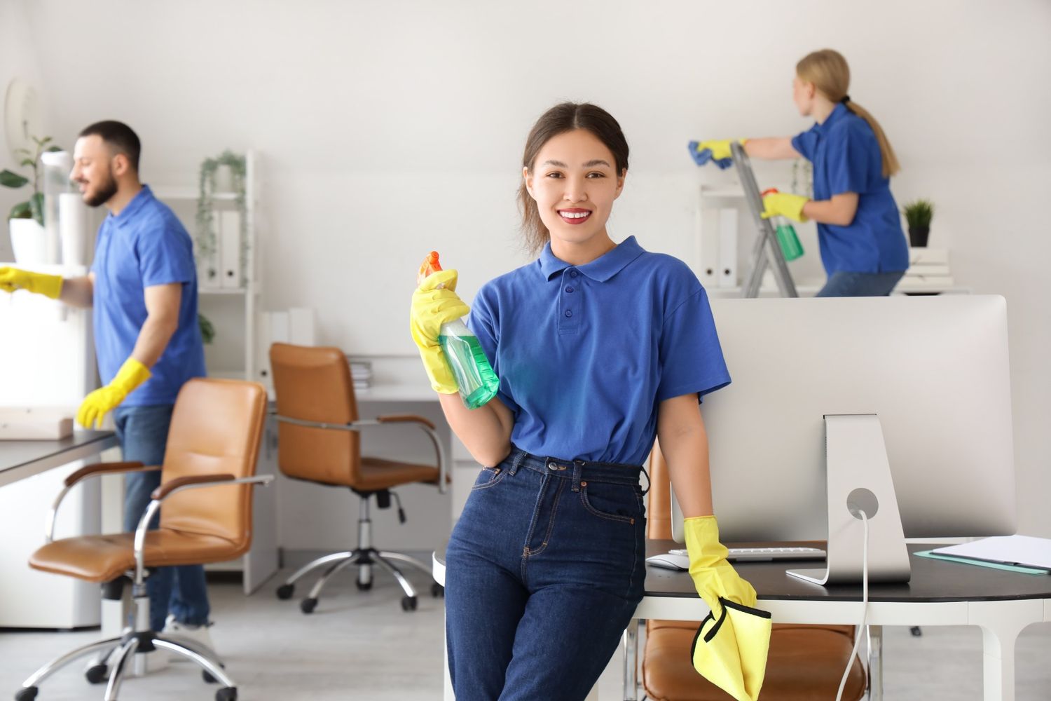 Professional janitorial services team in Singapore performing office sanitization and high-touch point disinfection.