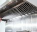 Professional kitchen exhaust system cleaning in Singapore using industrial degreasing agents to ensure SCDF fire safety compliance.